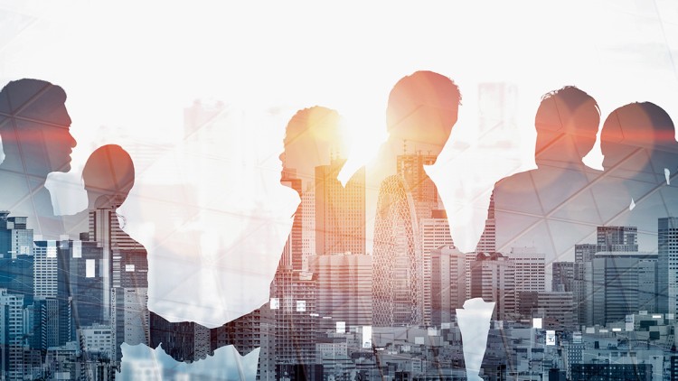 Symbolbild viele Menschen arbeiten zusammen